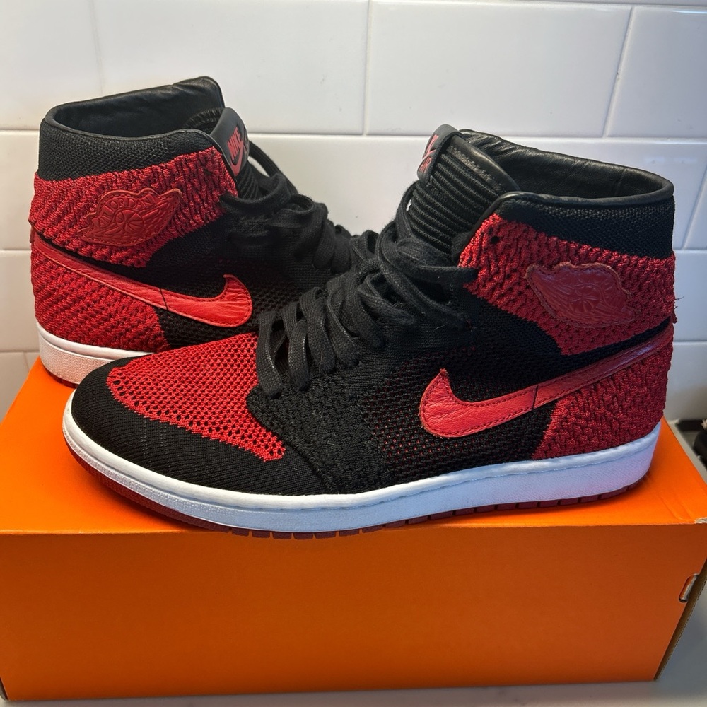 Nike Flyknit High-Top Black and Red Sneakers